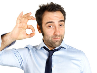 Friendly young businessman showing ok sign