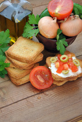 toast with tomato, oil, green olives