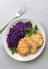Chicken fritters and stewed red cabbage with caraway seeds