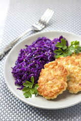Chicken fritters and stewed red cabbage with caraway seeds