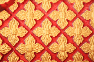 Golden Floral pattern on red wall