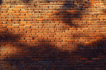 Old weathered brick wall fragment .