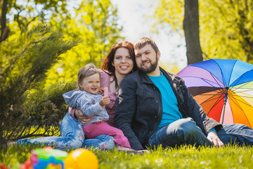 Fototapeta premium mother and father are plaing with their daughter