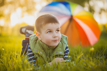 Portrait of a happy little boy in the park