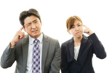 苦悩するビジネスマンとOL