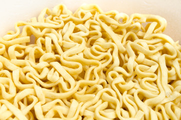 Dry instant noodle in a bowl