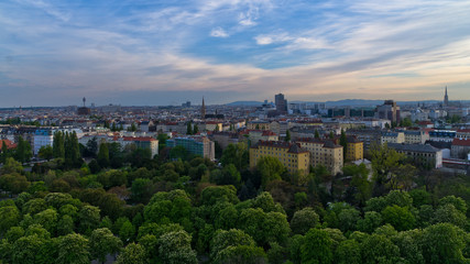 Vienna cityscape at sunset, different ages, styles and colors