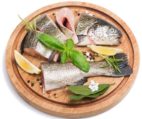 Pieces of a trout on a wooden surface
