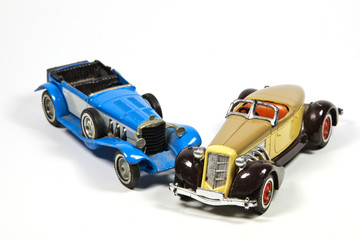 Two Vintage Toy Model Cars on White
