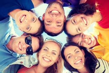 group of teenagers looking down