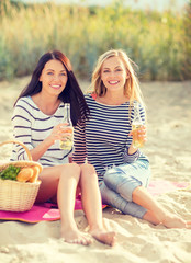 girls with drinks on the beach