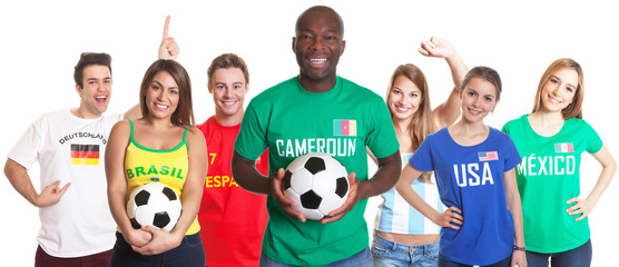 Fottball fan from Cameroon with ball and other fans