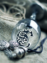Silver jewelry and  glass goblet