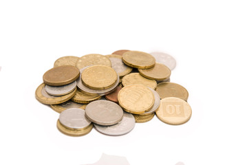 Full set of coins in pile isolated on white