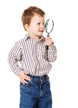 Little boy with magnifying glass