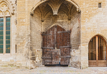 Fototapeta na wymiar Old doors at Popes Palace in Avignon, France