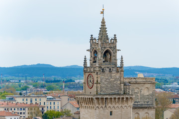 Fototapeta na wymiar Tower with clock in medieval town Avignon, France.