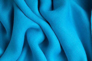 Blue background abstract cloth wavy folds of textile texture