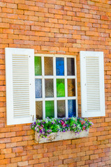 Fototapeta na wymiar Window on brick wall