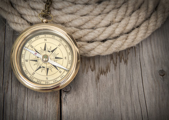 Fototapeta na wymiar Exploring background with compass and rope