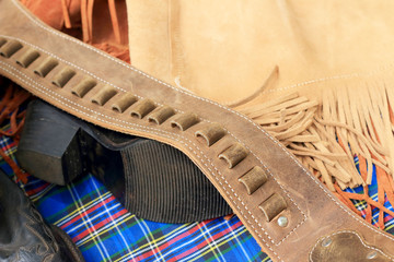 Obraz premium belt with buckle and holster the gun and ammo.