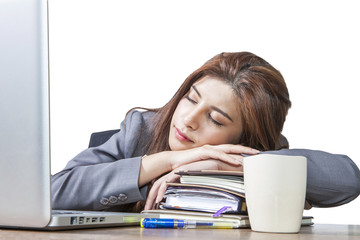 Young business woman sleeping at workplace
