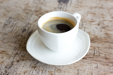 Cup of coffee on a wooden table