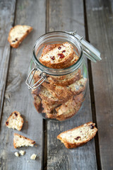 Biscotti with almonds and cranberries in a pot with a lid
