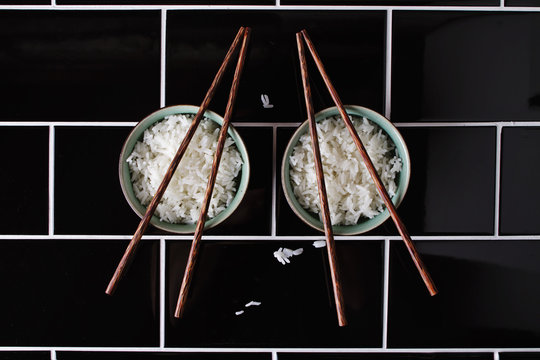 Creative artistic shapes using bowl of rice and chopsticks