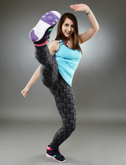 Woman executing a high kick
