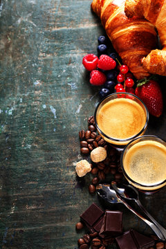 Coffee with croissants and berries