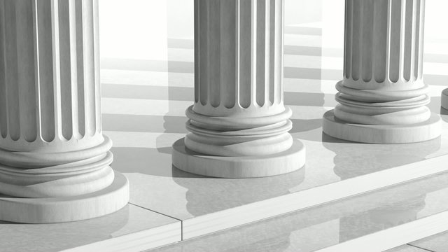 White ancient marble pillars in a row