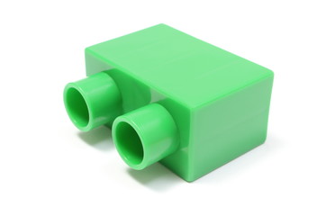 Green building block on white background