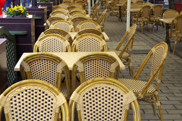 Street cafe with wicker chairs.