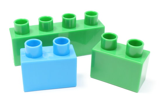 Green and blue building blocks on white background