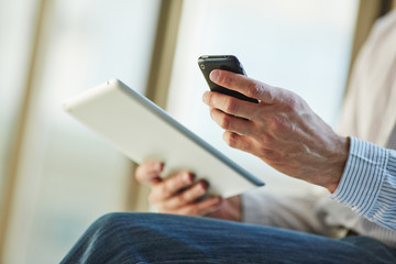 man holding digital tablet