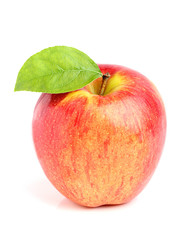 Ripe beautiful apple with a leaf.