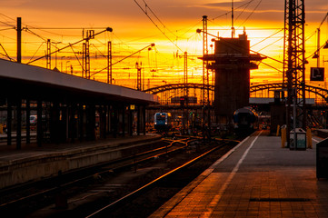 Fototapeta premium Railway station with sunset sky