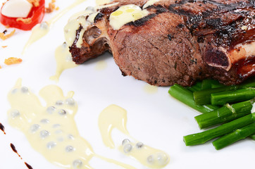 rack of lamb on grill with an asparagus