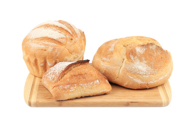 Various of bread on cutting board.