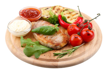 Grilled steak with spices, herbs and vegetables