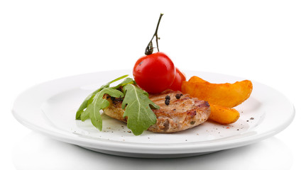 Grilled steak with fried potato pieces and grilled vegetables,