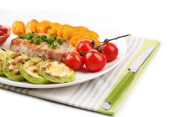 Grilled steak and grilled vegetables on plate, isolated on