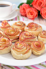 Fototapeta na wymiar Tasty puff pastry with apple shaped roses
