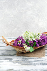 Beautiful spring flowers in wicker basket
