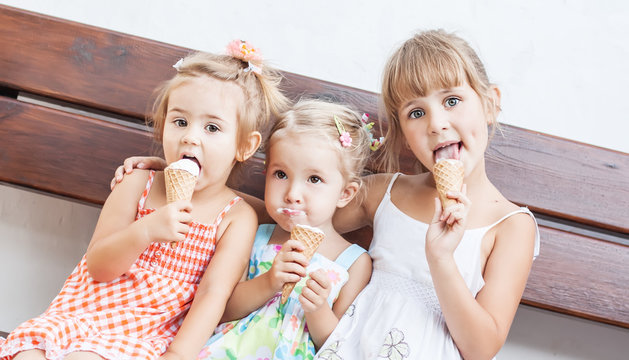 funny children girls eating ice cream