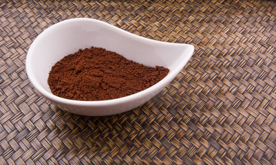 Instant coffee powder in ceramic container 