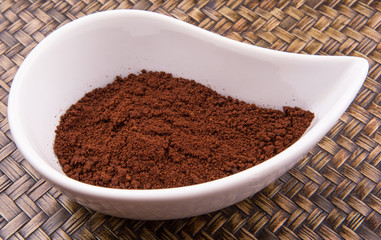 Instant coffee powder in ceramic container 