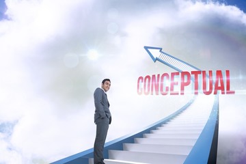 Conceptual against red staircase arrow pointing up against sky