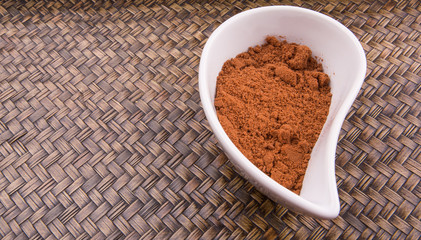 Cocoa powder for making drinks in a white ceramic